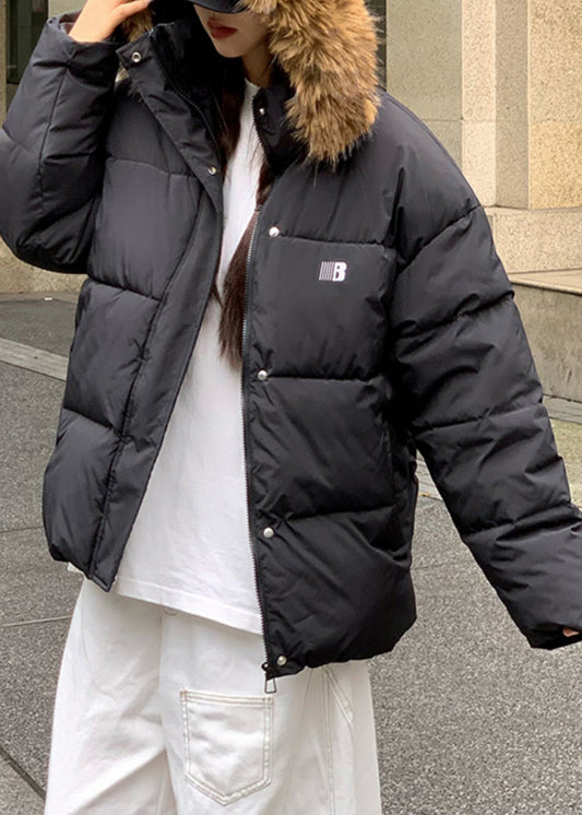 Schwarzer Patchwork-Parka mit Kapuze, Reißverschlusstaschen und Patchwork-Design für den Winter