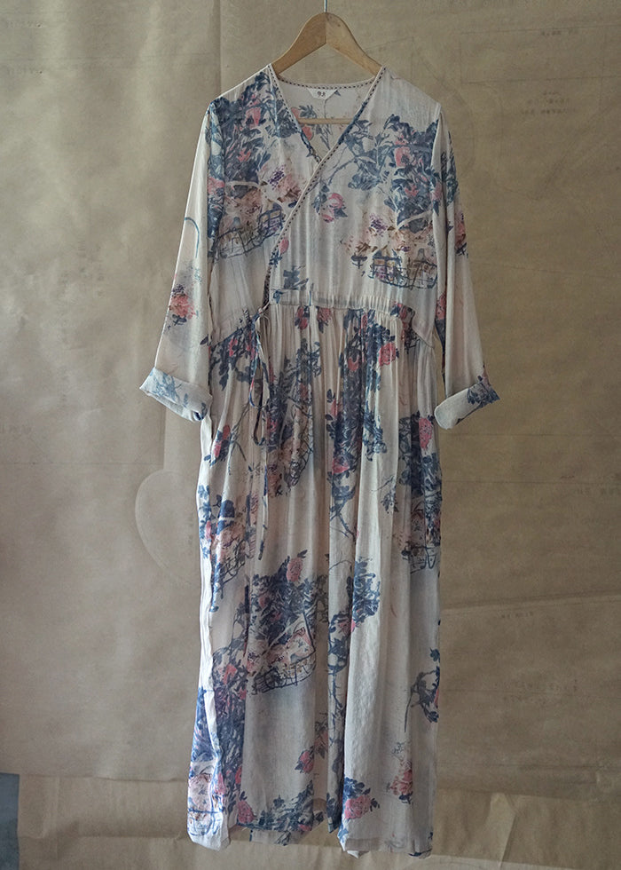 Blaues, bedrucktes, langes Urlaubskleid mit Bindegürtel, V-Ausschnitt, lange Ärmel