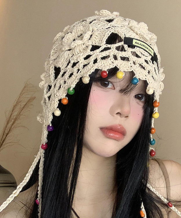 Sombrero boonie bohemio beige con borlas y flores huecas