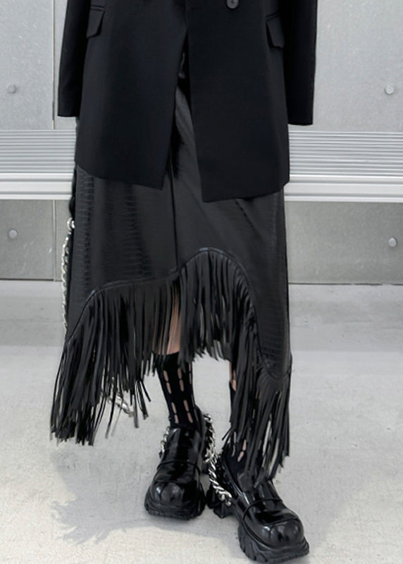 Schwarzer, hochtaillierter A-Linien-Rock im Boho-Stil mit Quasten-Patchwork aus Kunstleder für den Herbst