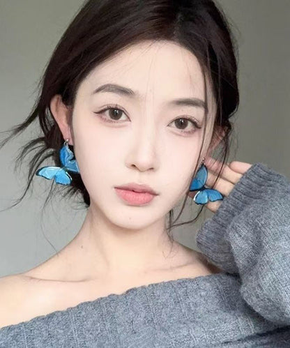 Pendientes colgantes de mariposa con perlas de aleación de cobre azul bohemio