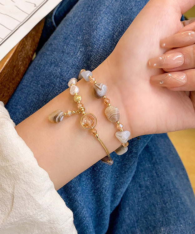 Pulsera Bohemia con múltiples cuentas de cobre dorado y perla de cristal