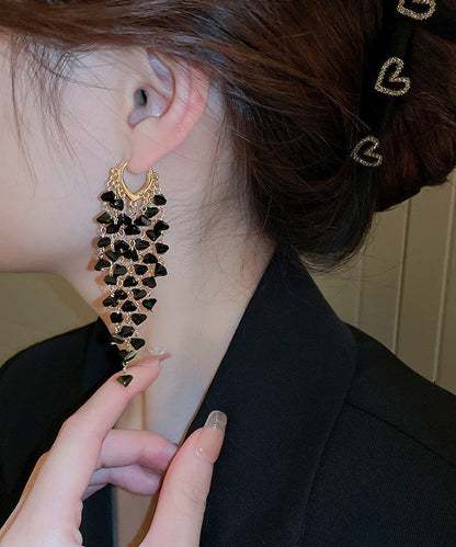 Pendientes bohemios con borlas de amor y cristales dorados en plata de ley negra