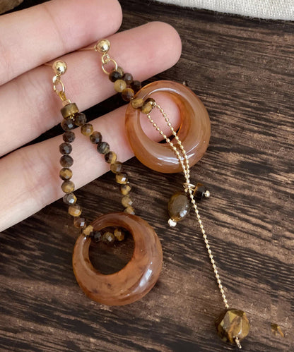 Boho-Ohrhänger aus brauner Legierung mit Edelstein-Blütenblattquaste und asymmetrischem Anhänger