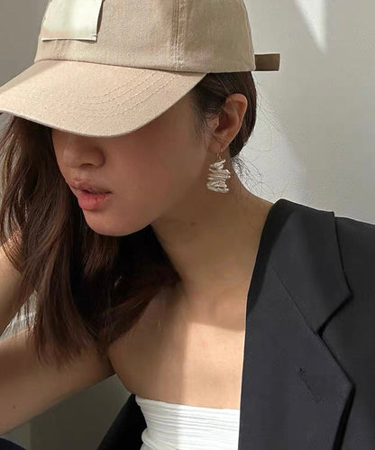 Pendientes bohemios de perla irregular en oro blanco de 14 quilates