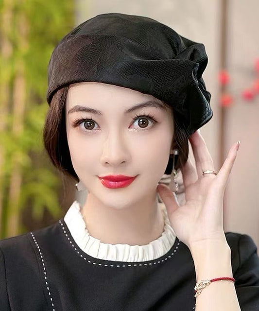 Boina de seda arrugada con estampado negro de Boutique