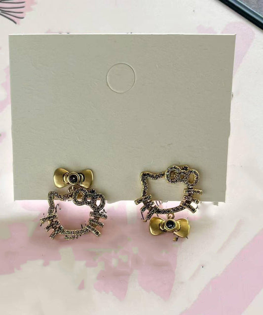 Pendientes boutique con lazo de gatito y circonitas de cobre y oro