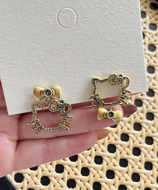 Pendientes boutique con lazo de gatito y circonitas de cobre y oro