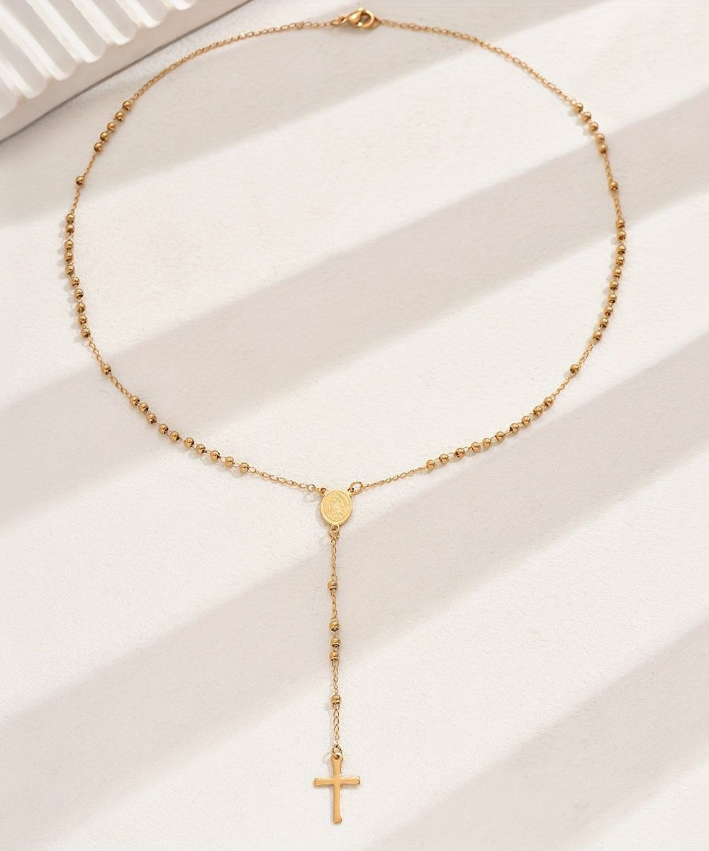 Collar con colgante de cruz de aleación de acero inoxidable y oro boutique