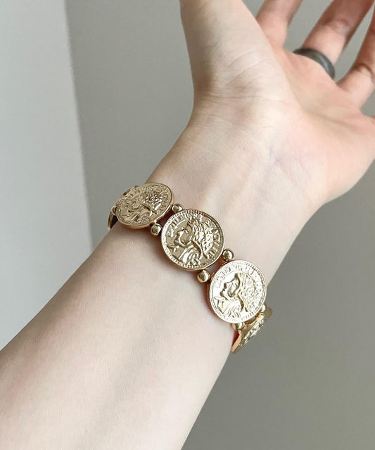 Boutique-Armreif aus Gold, Sterlingsilber, Legierung und Kupfermünze