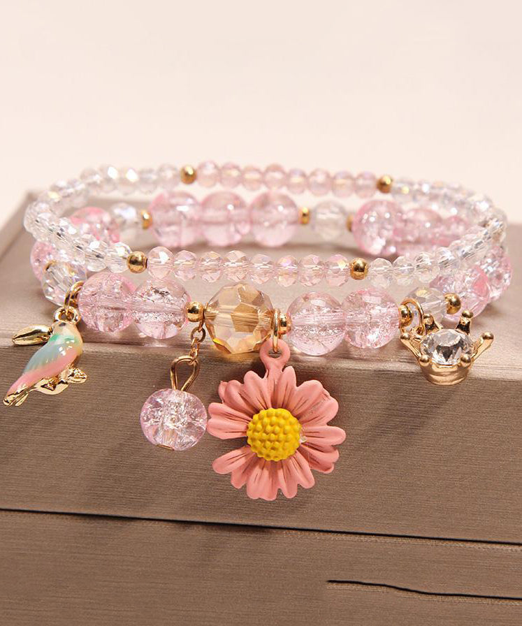 Pulsera boutique con dije de pajarito floral de cristal rosa
