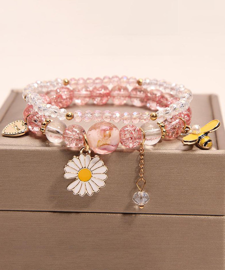 Pulsera boutique con dije de pajarito floral de cristal rosa