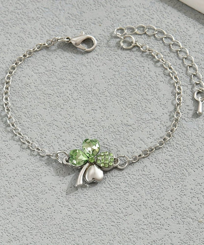 Pulsera de acero inoxidable con dije floral de cristal de seda boutique