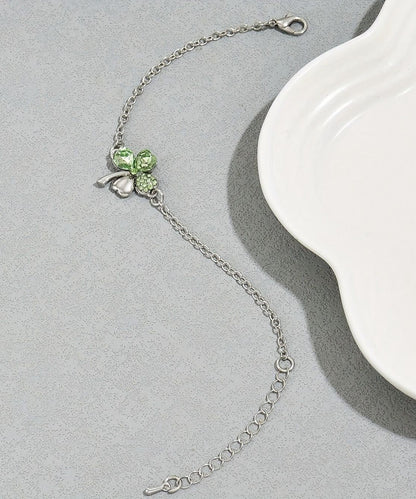 Pulsera de acero inoxidable con dije floral de cristal de seda boutique