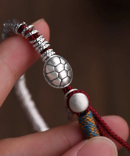 Boutique Seidenarmband aus Sterlingsilber mit Anhängern aus gebrochenem Silber