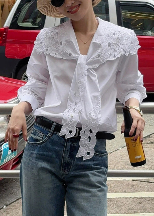 Top de algodón blanco con encaje bordado y huecos de Boutique Primavera