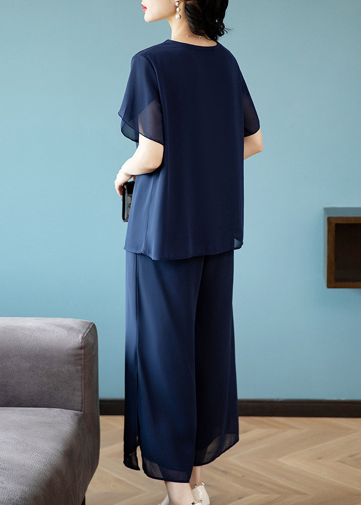 Lässiges zweiteiliges Set aus blauem Chiffon-Top mit V-Ausschnitt und Stickerei sowie Cropped-Hose für den Sommer