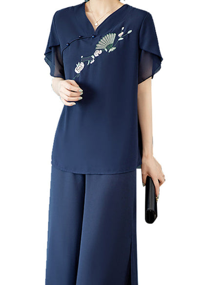 Lässiges zweiteiliges Set aus blauem Chiffon-Top mit V-Ausschnitt und Stickerei sowie Cropped-Hose für den Sommer