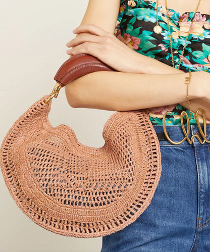 Bolso de mano informal de piel sintética con forma redonda y hueco en marrón