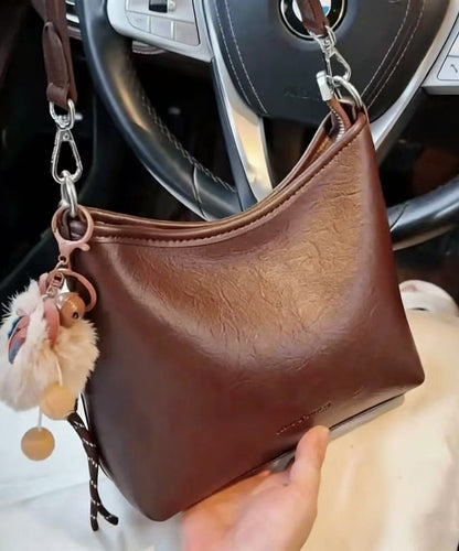 Casual Brown Letter Embossing Fuzzy Ball Decorated Faux Leather Micro Bag