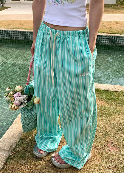 Pantalones casuales de algodón con cintura elástica y bolsillos a rayas verdes para verano