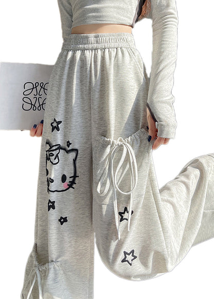 Pantalones casuales de algodón gris claro con cintura elástica y bolsillos estampados para primavera