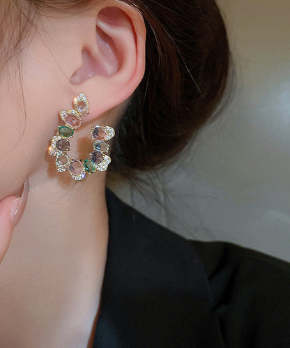 Pendientes de aro asimétricos en forma de U con cristales de circonita y cobre arcoíris