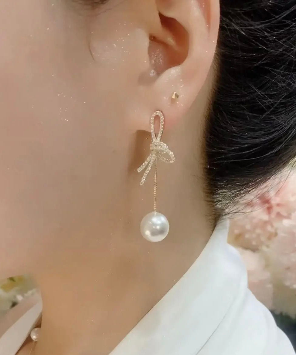 Lässige weiße Ohrringe mit Schleife aus Sterlingsilber