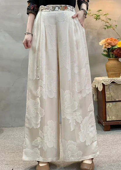 Lässige gelbe Seidenhose mit Quasten, bestickten Taschen und Herbst