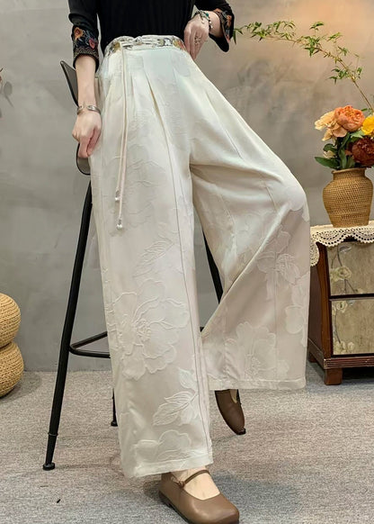 Lässige gelbe Seidenhose mit Quasten, bestickten Taschen und Herbst