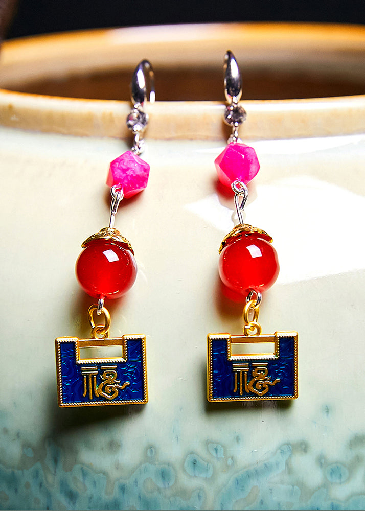 Pendientes colgantes de metal con candado dorado y diseño asimétrico elegante