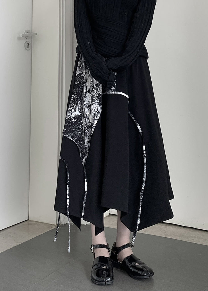 Schicker schwarzer, asymmetrisch bedruckter Baumwollrock in A-Linie für den Frühling