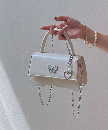 Minibolso elegante de piel sintética con diseño de mariposa negra y cadena