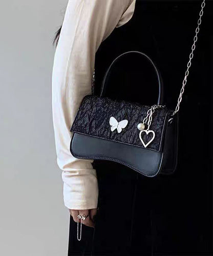 Minibolso elegante de piel sintética con diseño de mariposa negra y cadena