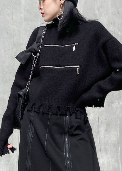 Schicker schwarzer Herbstpullover mit Reißverschluss und Quasten