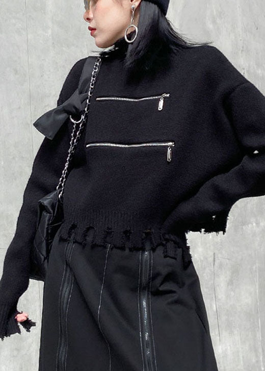 Schicker schwarzer Herbstpullover mit Reißverschluss und Quasten