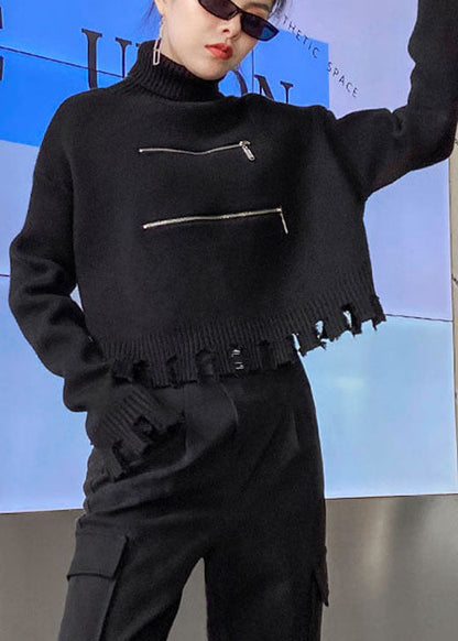 Schicker schwarzer Herbstpullover mit Reißverschluss und Quasten