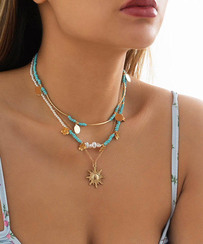 Collar con colgante desmontable de bola de arroz floral de aleación azul elegante