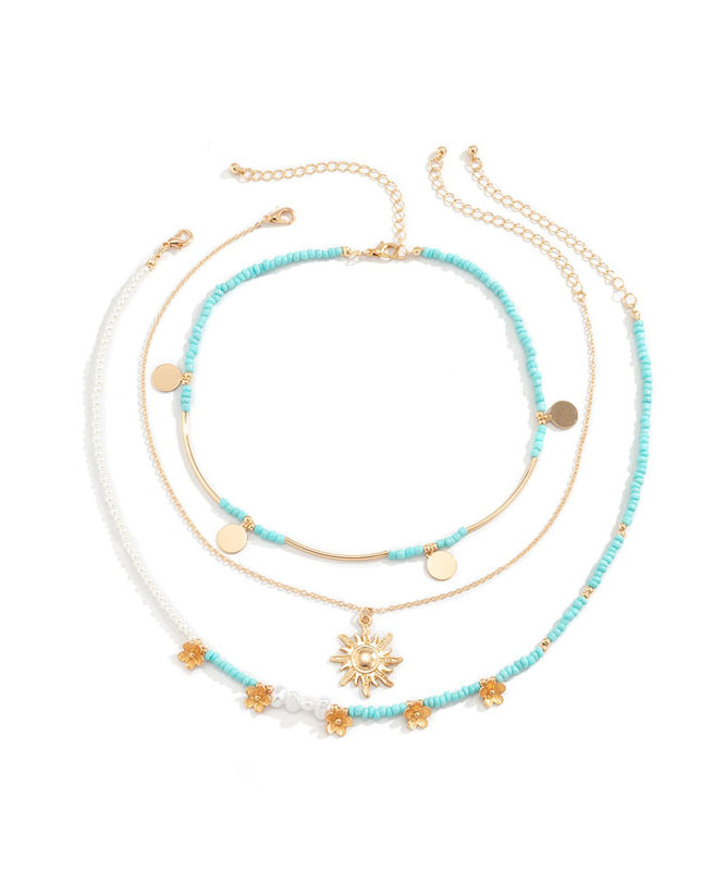 Collar con colgante desmontable de bola de arroz floral de aleación azul elegante