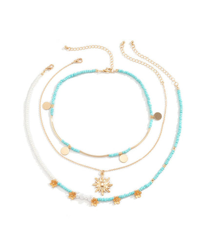 Collar con colgante desmontable de bola de arroz floral de aleación azul elegante