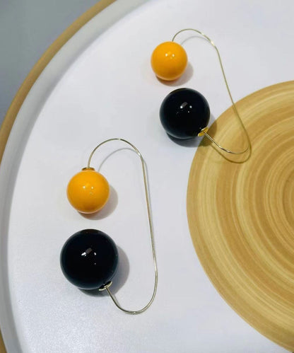 Pendientes elegantes de aro con bolas de resina de cobre y bloques de color