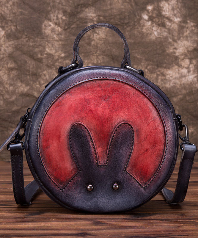 Schicke dunkelgraue Umhängetasche aus Leder mit Tier-Patchwork-Muster