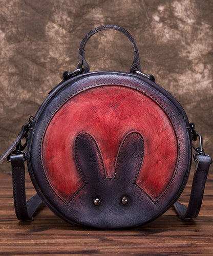 Schicke dunkelgraue Umhängetasche aus Leder mit Tier-Patchwork-Muster