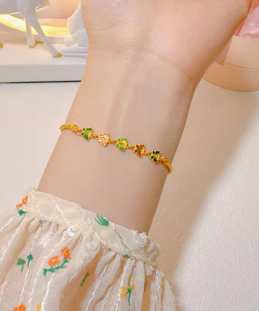Pulsera elegante con dije floral cloisonné dorado antiguo