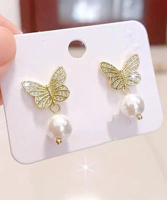 Elegantes pendientes de mariposa con perlas doradas y plateadas