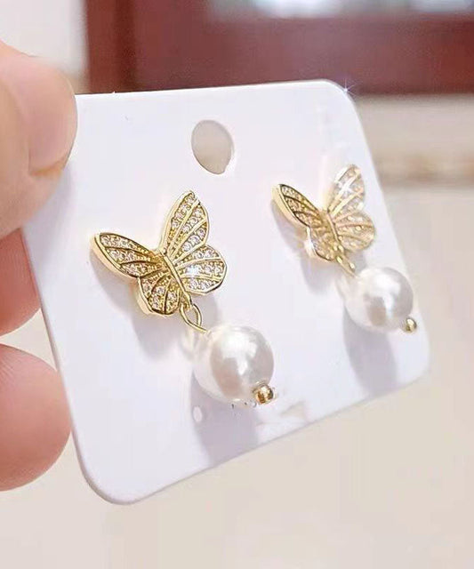 Elegantes pendientes de mariposa con perlas doradas y plateadas