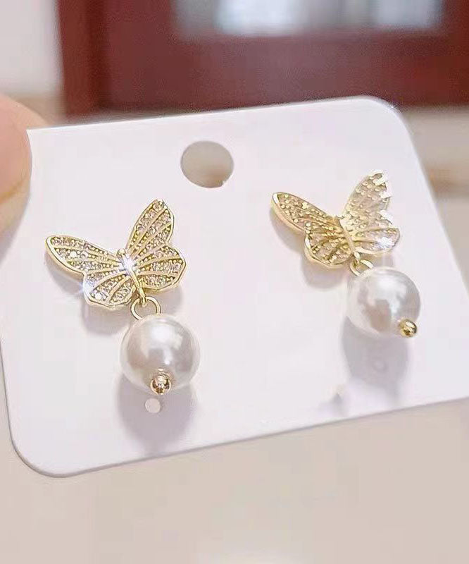 Elegantes pendientes de mariposa con perlas doradas y plateadas