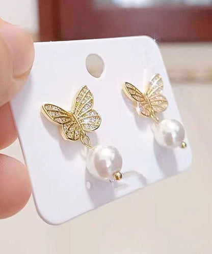 Elegantes pendientes de mariposa con perlas doradas y plateadas