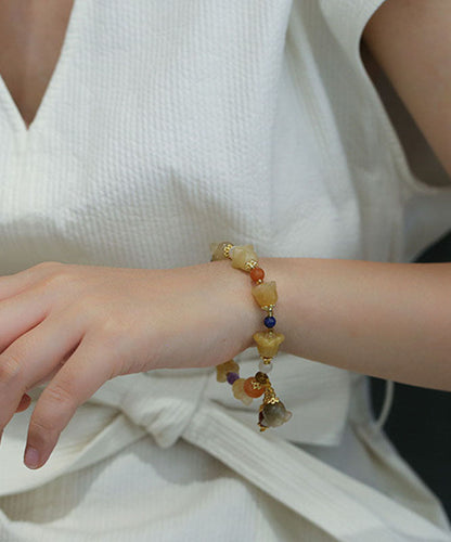 Schickes Charm-Armband „Lilie der Ringe“ aus goldener Seide und Jade