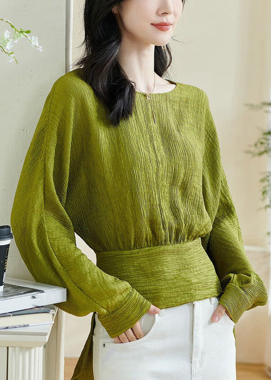 Top verde chic con cuello redondo y patchwork, lazo y mangas farol